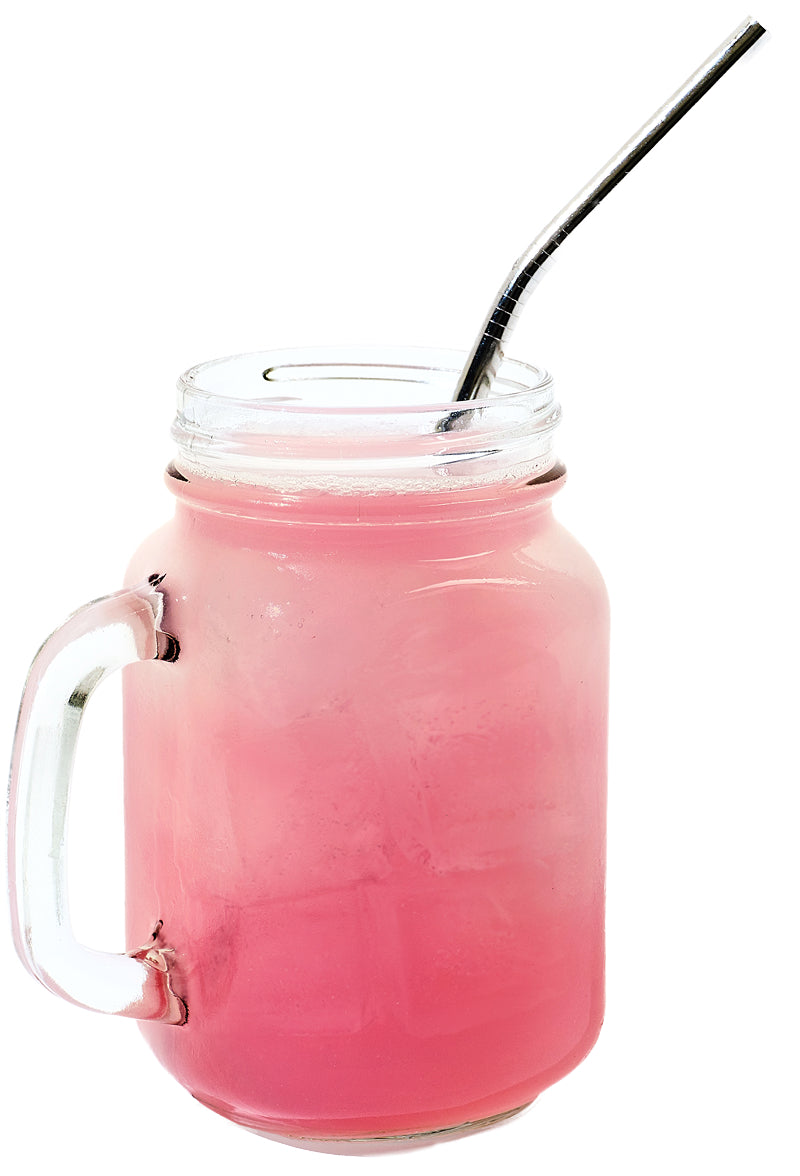 Front close-up of pink iced drink in a mason jar with handle and stainless steel straw on white background